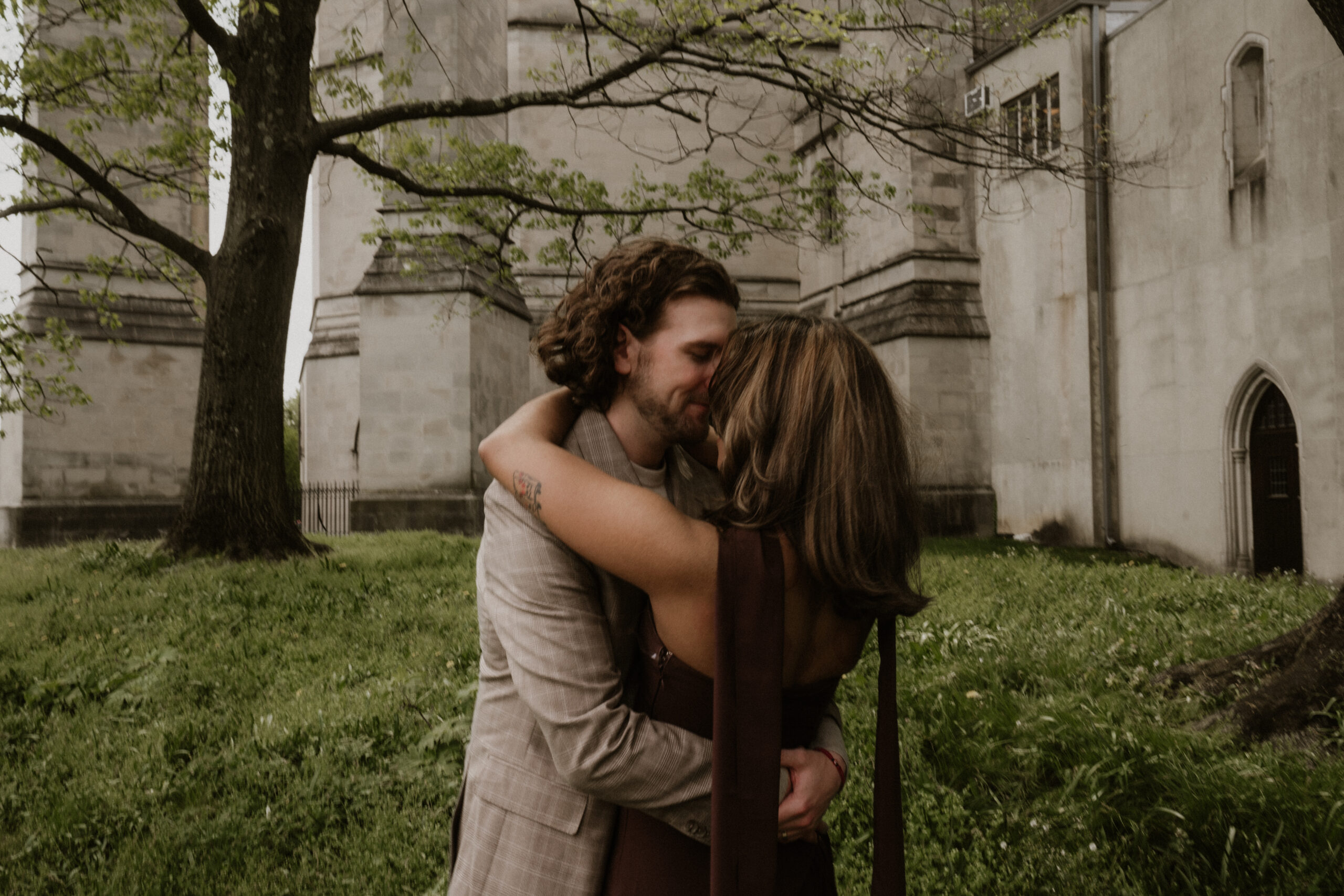 A couple embracing in front of the National Cathedral