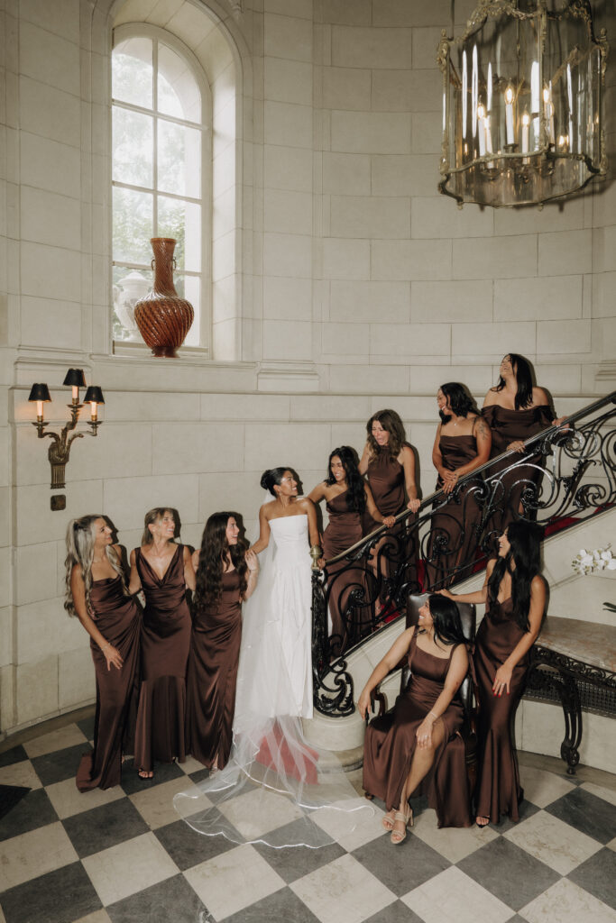 bride and bridesmaids laughing together in meridian house venue, photographed by dc wedding photographer ashton sotiro