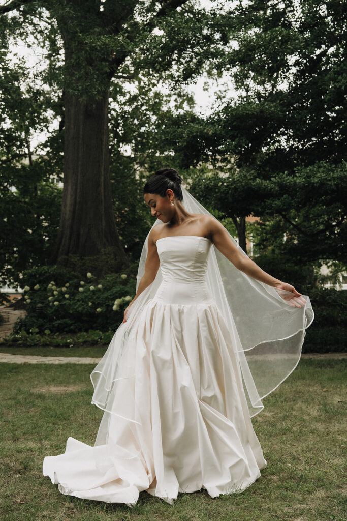 a bride playing with her veil on her wedding day
