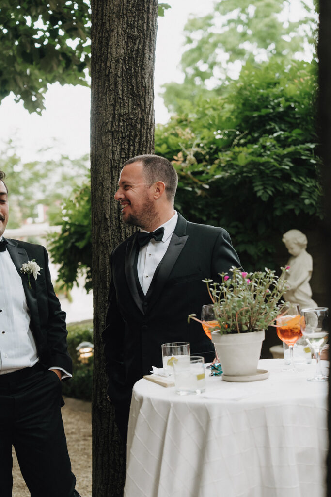 guests speaking to each other during cocktail hour at a wedding