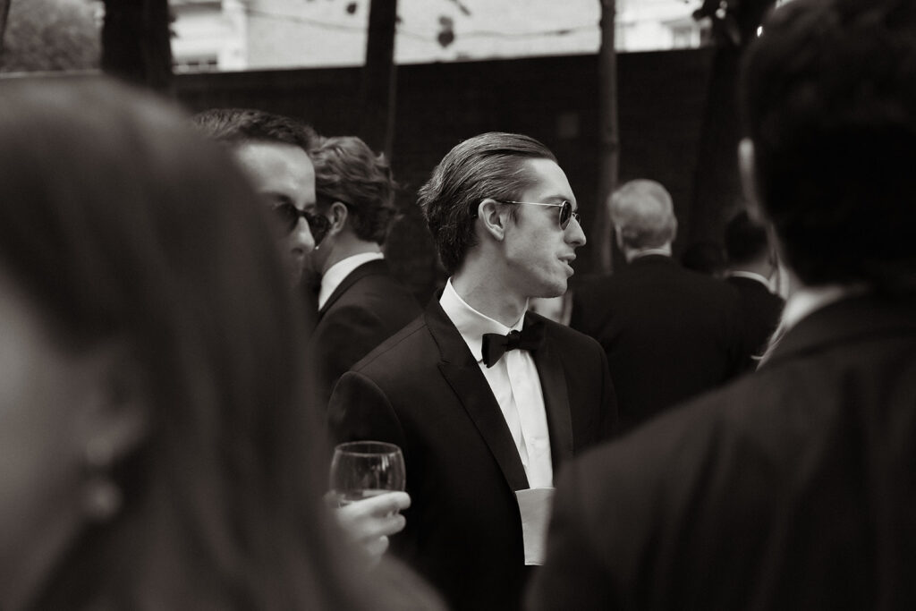 guests speaking to each other during cocktail hour at a wedding