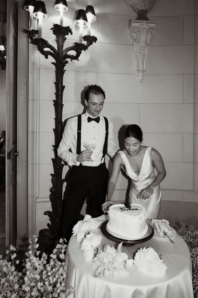 newlyweds cutting their wedding cake