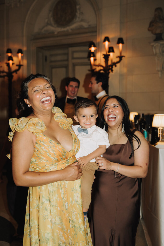 friends laughing at a meridian house wedding