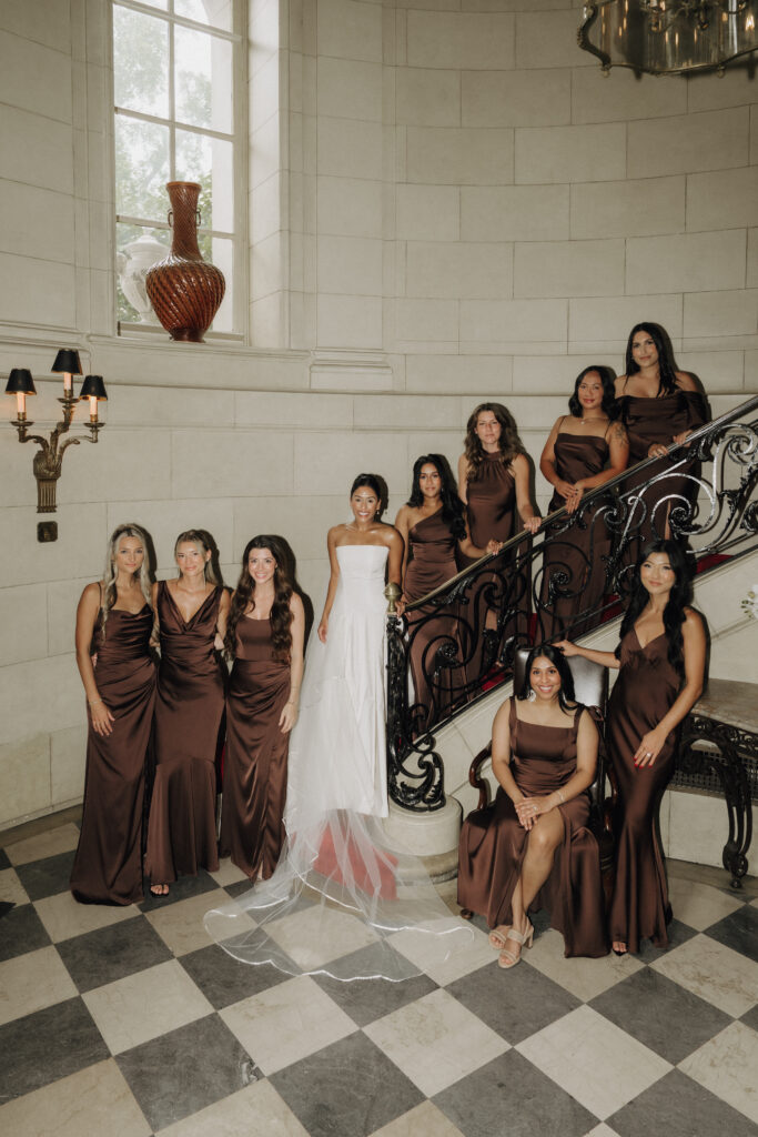 bride and bridesmaids posing together in meridian house venue, photographed by dc wedding photographer ashton sotiro